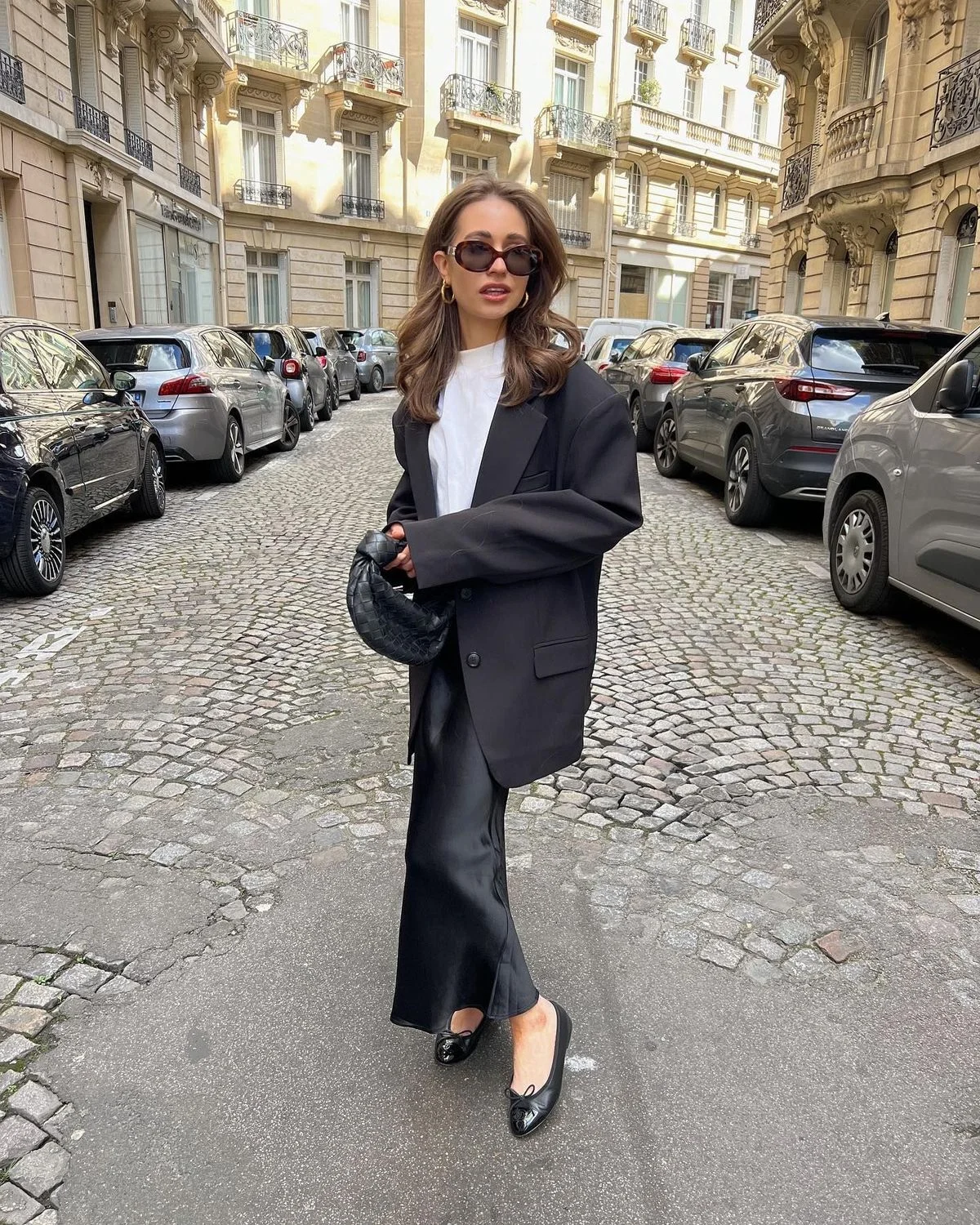 Oversized black blazer and white tee with black satin skirt outfit
