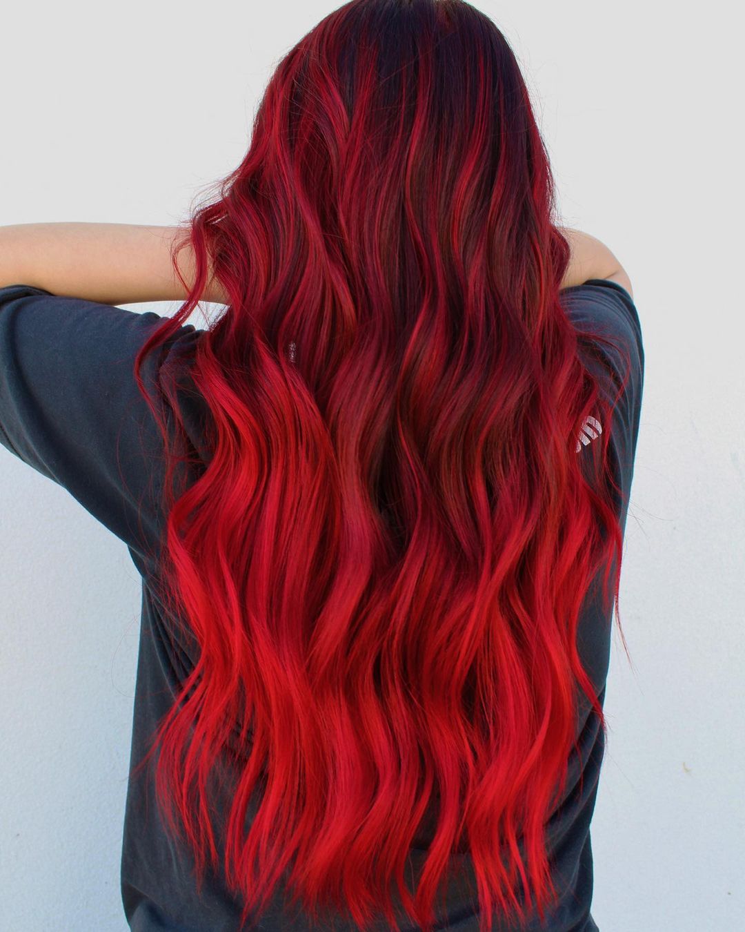Black-to-Red Fade Through the Lengths red hair color