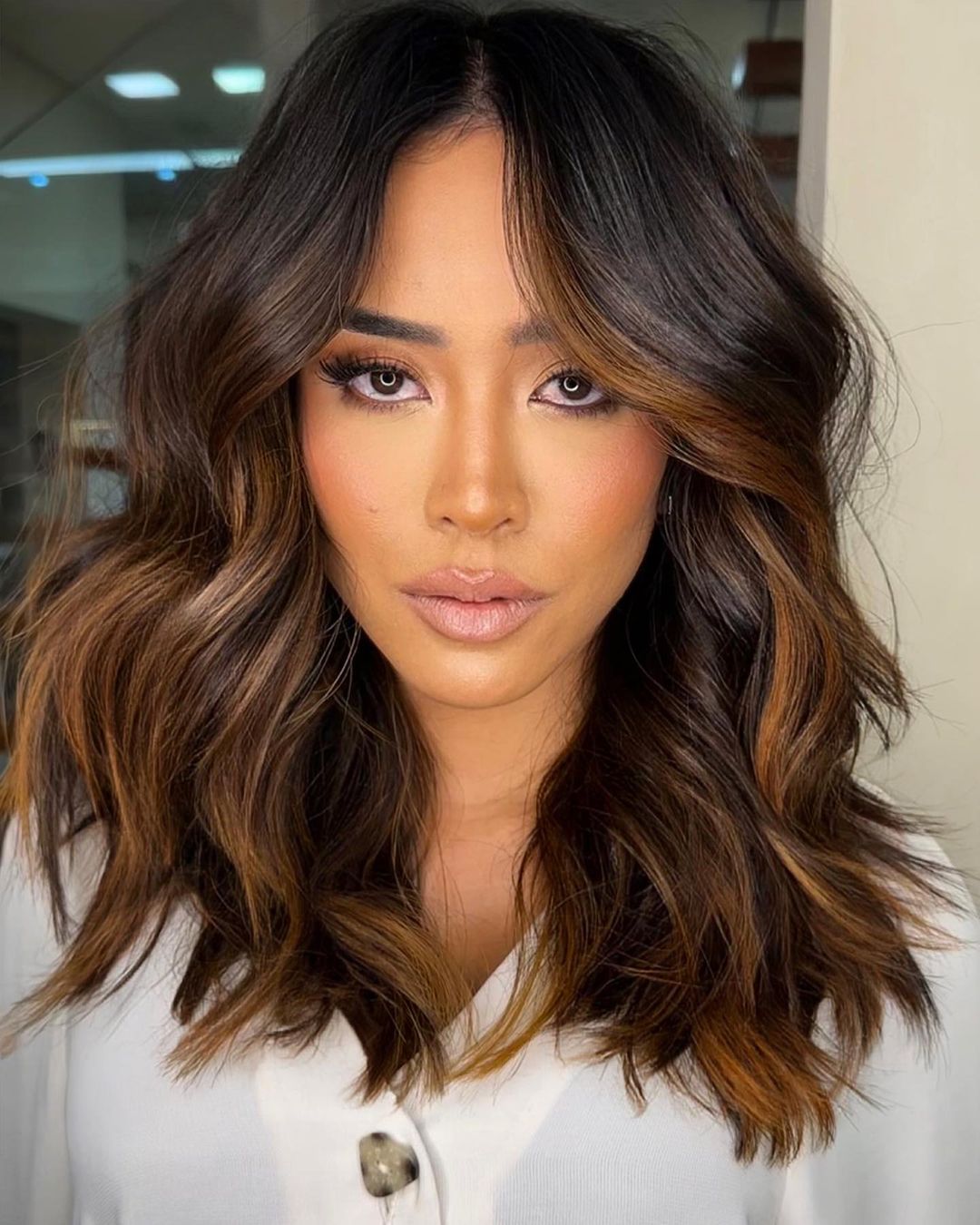 Mid-length cut with copper balayage medium hair