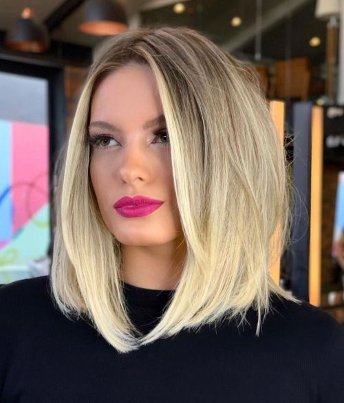 Lob haircut with middle part and face-framing layers