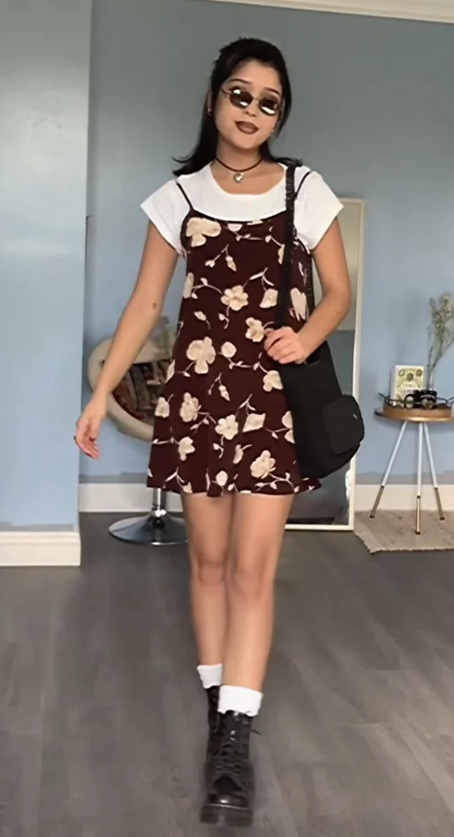 Floral slip dress over a white tee with combat boots