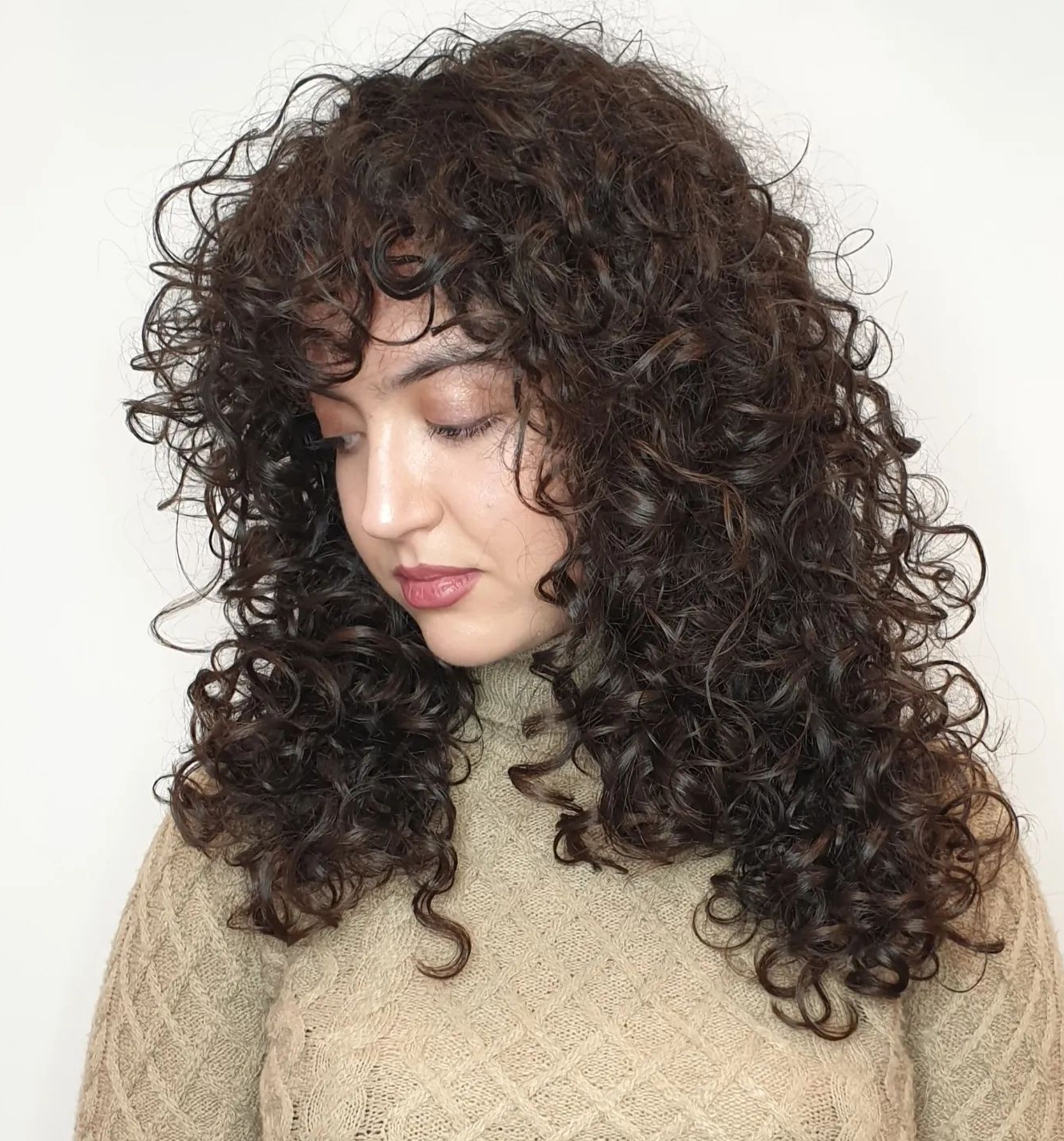 Long U-shaped curly shag with volumizing layers