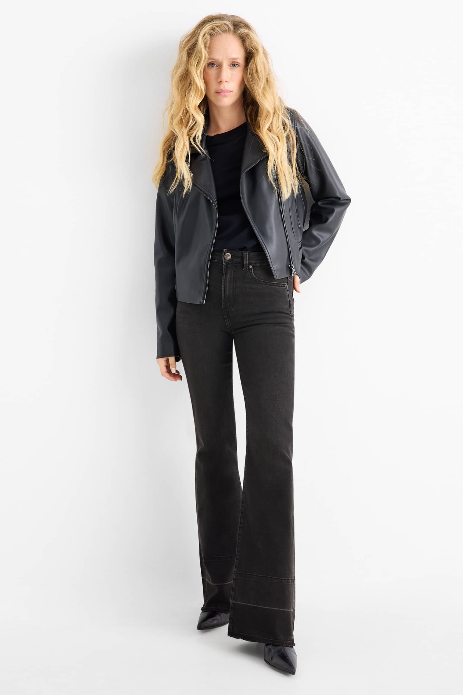 Leather-Look Jacket with a Black Top and Black Flare Jeans black flare jeans outfit