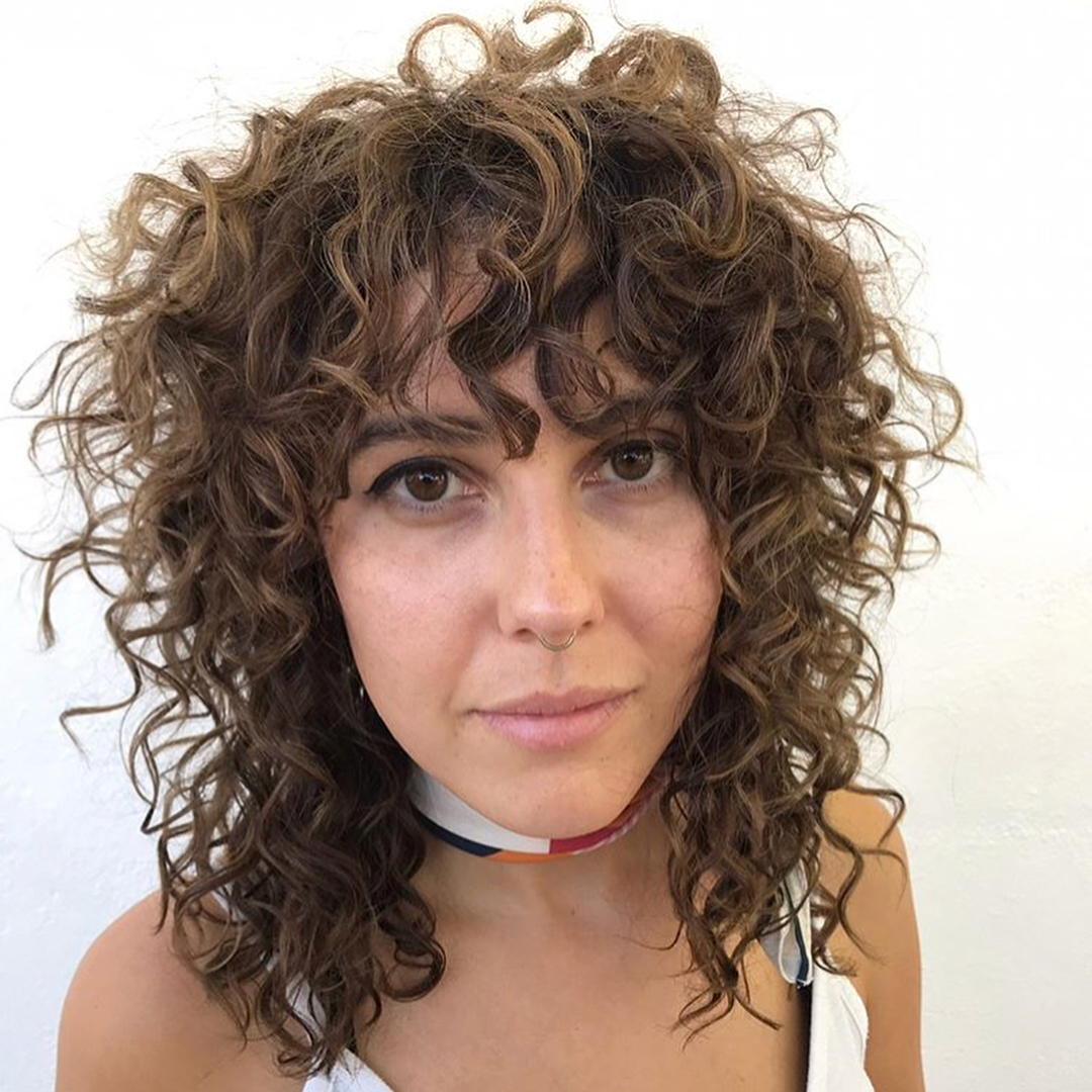 Medium curly shag with short and long layers