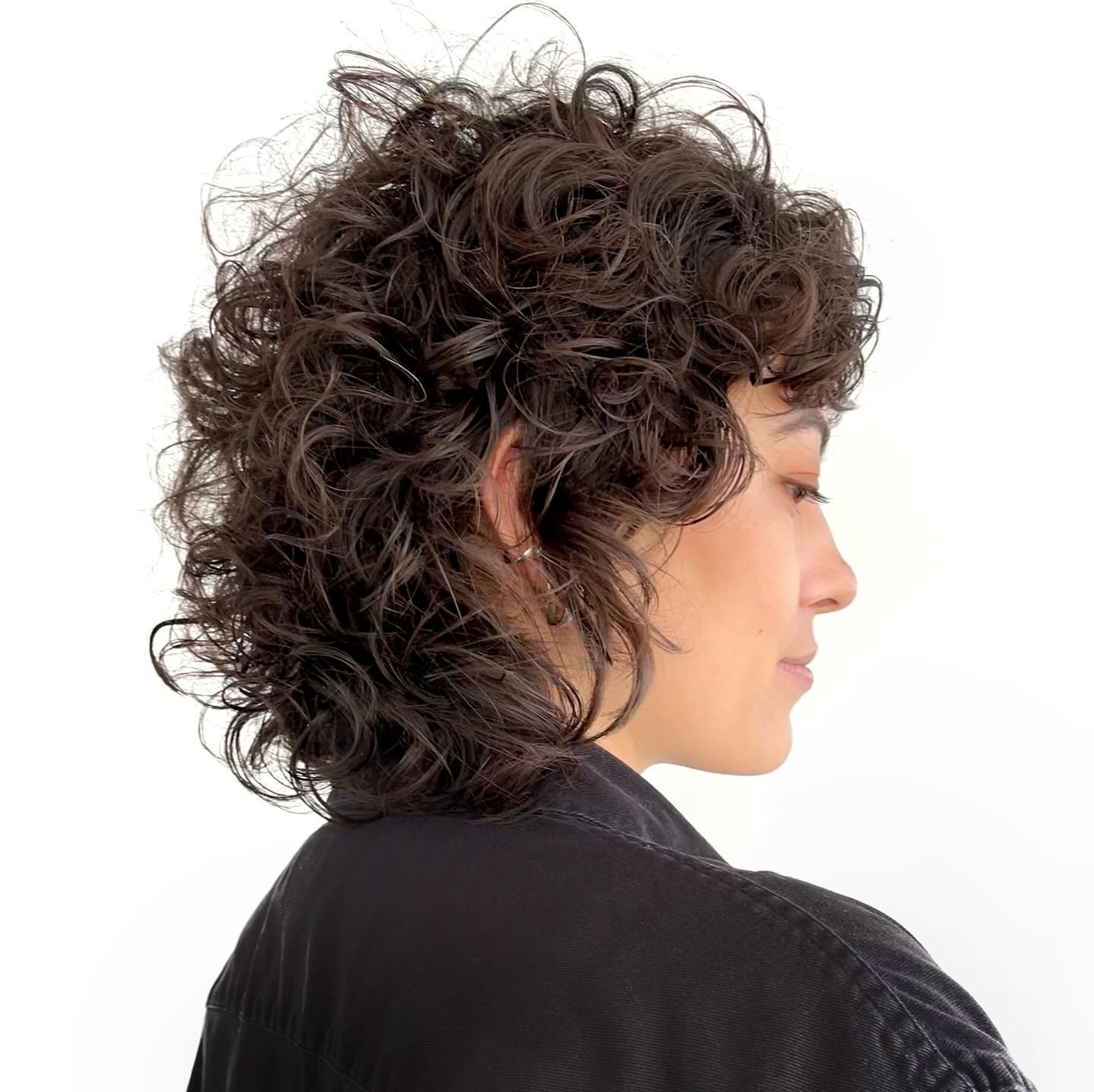 Short rounded curly shag with a messy fringe