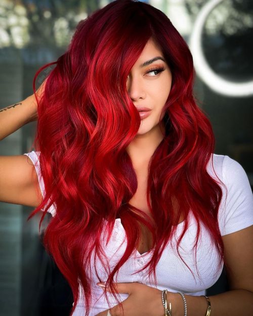 Vivid Red Softened by Shadowed Dark Roots red hair color