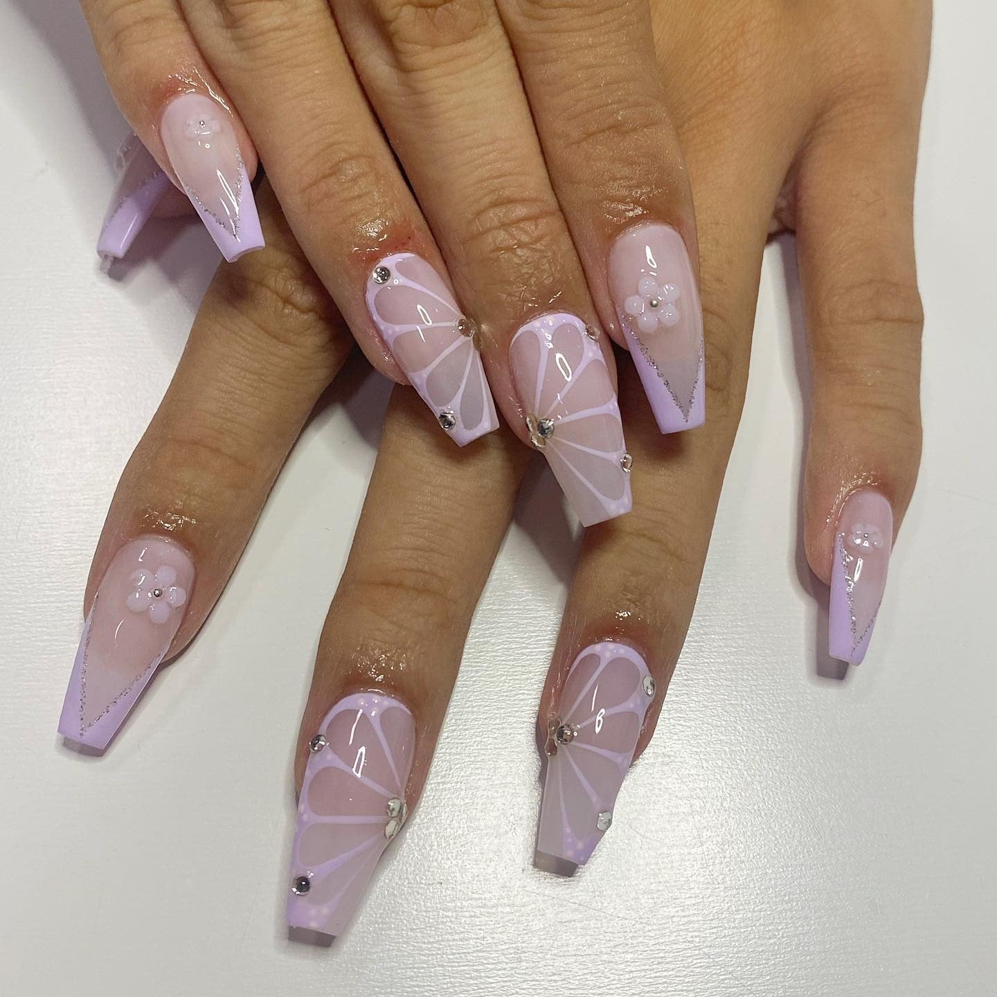 Lilac butterfly line art on coffin nails