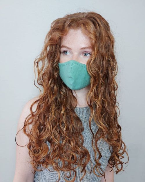 Long copper curls worn loose