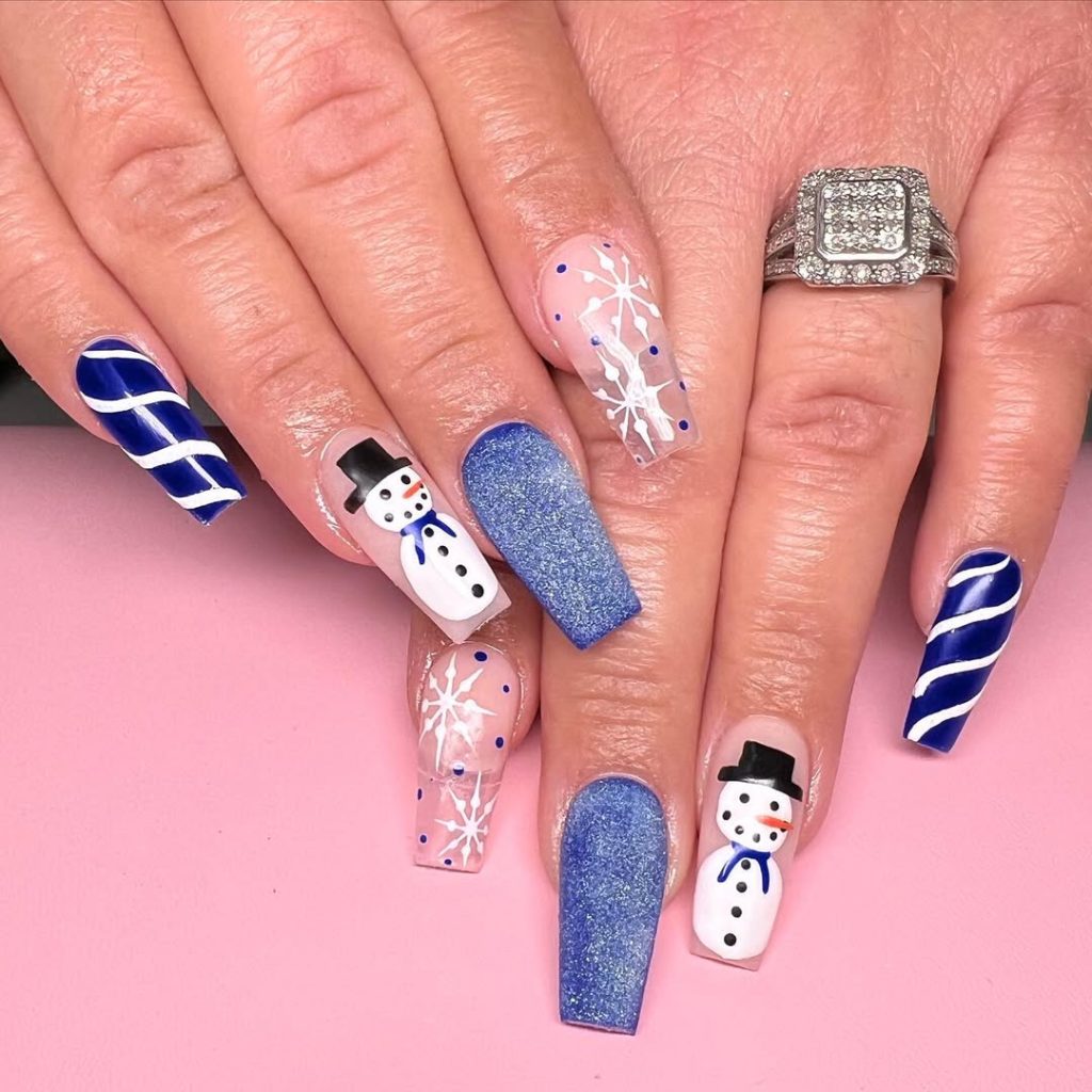 Blue Shimmer Nails with Snowmen and Candy Stripes blue winter nail design