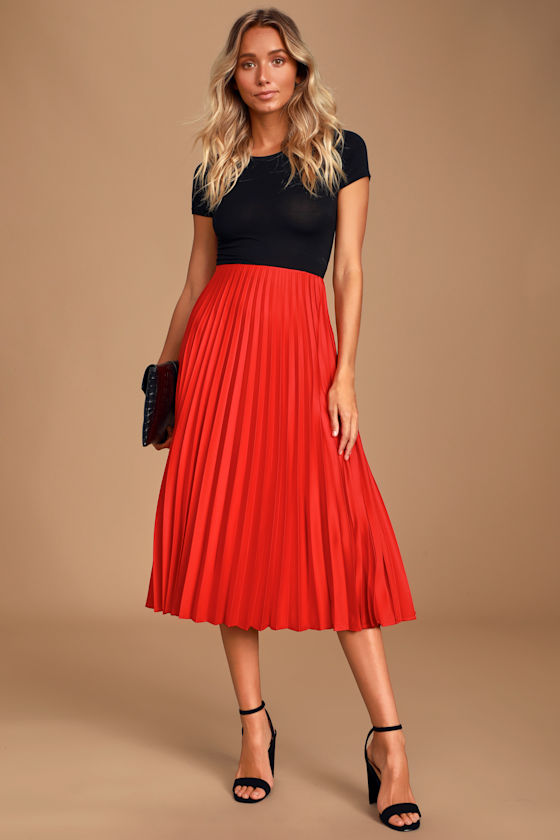 Black Top with a Red Pleated Satin Skirt casual date night outfit