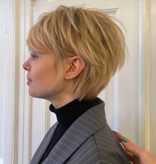 Voluminous Golden-Blonde Bixie with Side Sweep pixie cut idea