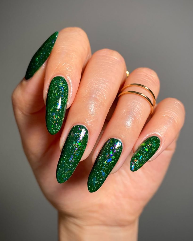 Dark green sparkle nails manicure