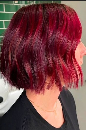 Glossy Cherry Red Bob With a Sharp Blunt Edge red hair color look