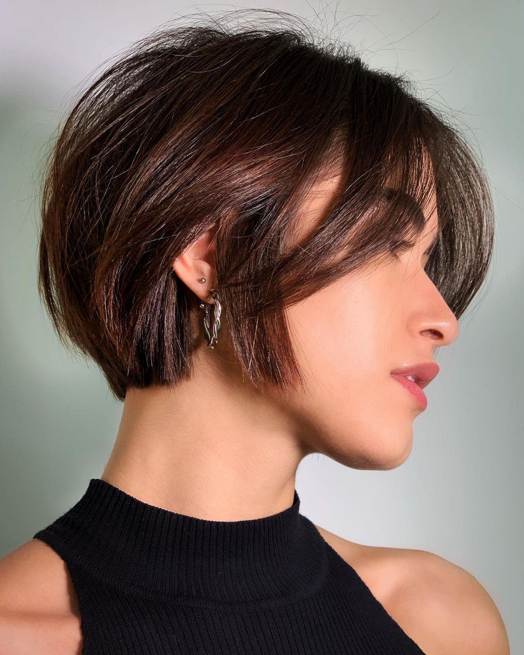 Blunt bob with long bangs and layers short hair hairstyle