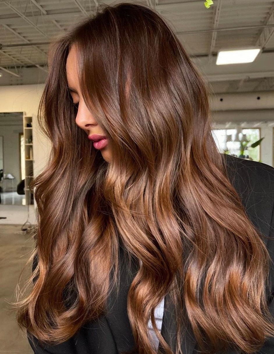 Warm toffee caramel on long layered hair