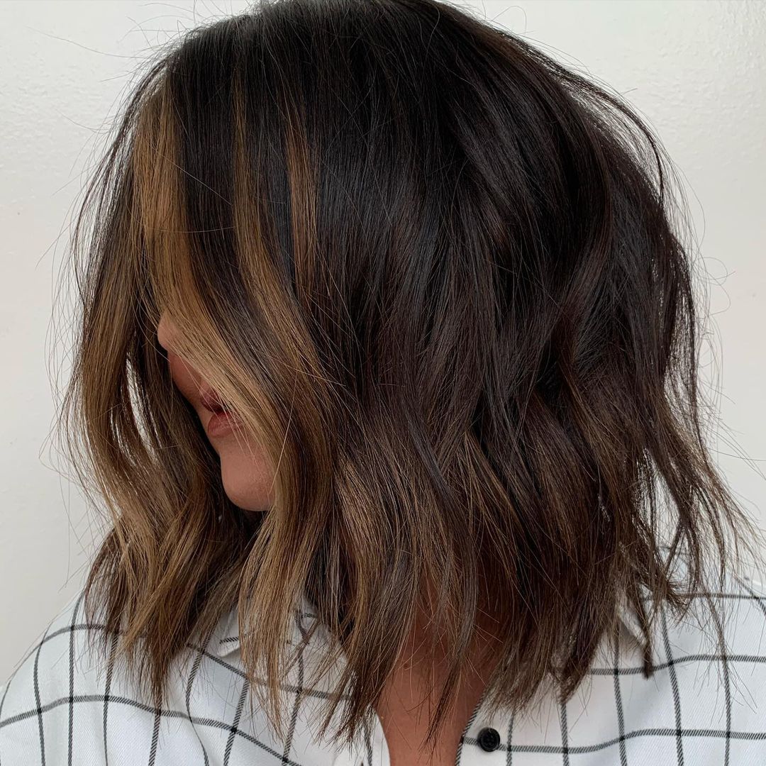 Tousled bob with caramel streaks caramel brown hair