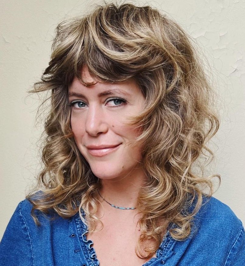 Medium wolf cut with thick full bangs wolf cut curly hair