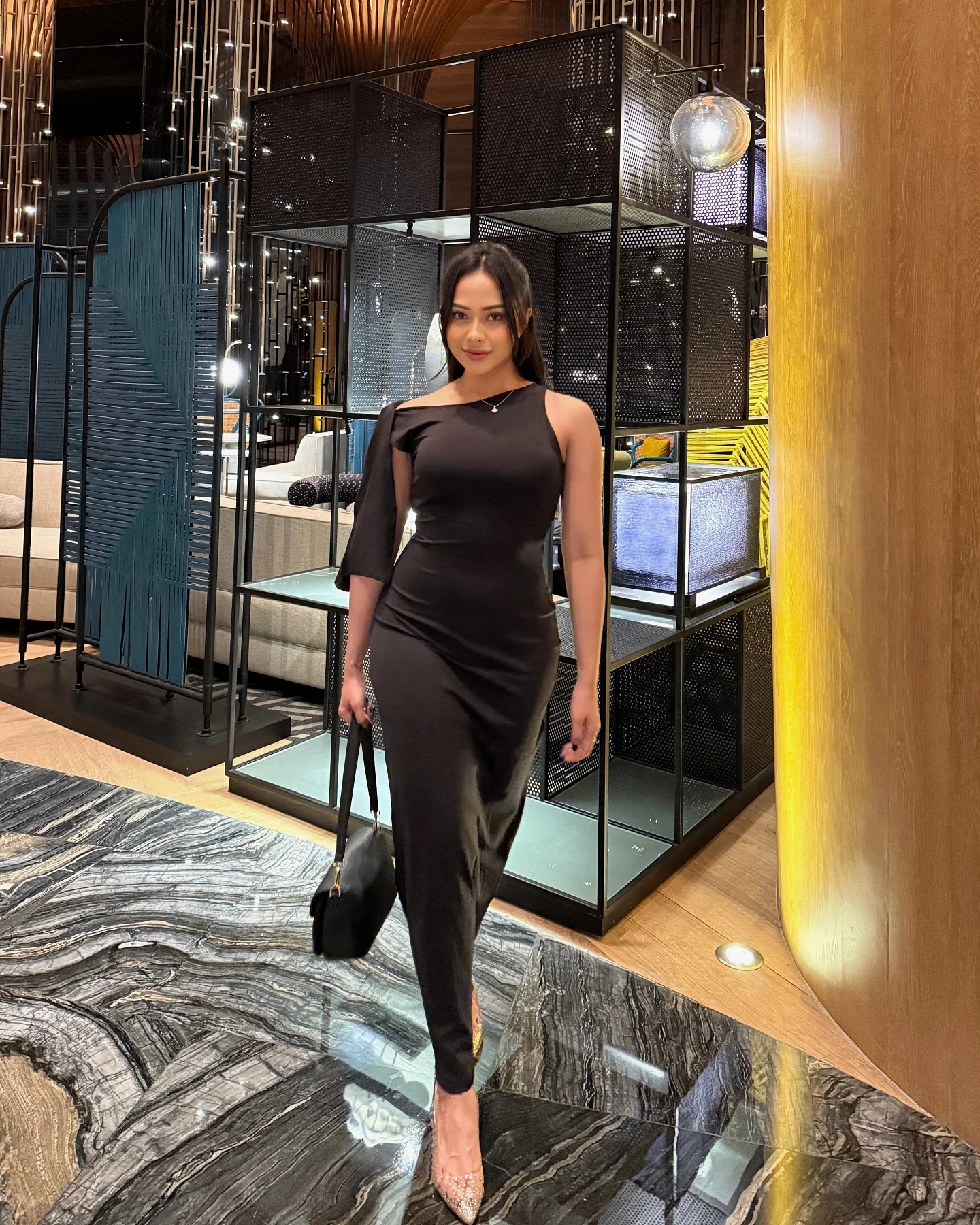 One-shoulder black dress with gold jewellery cute dinner outfit
