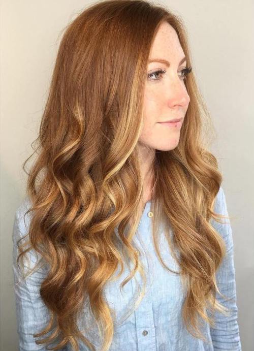 Subtle blonde balayage partial highlights on auburn hair