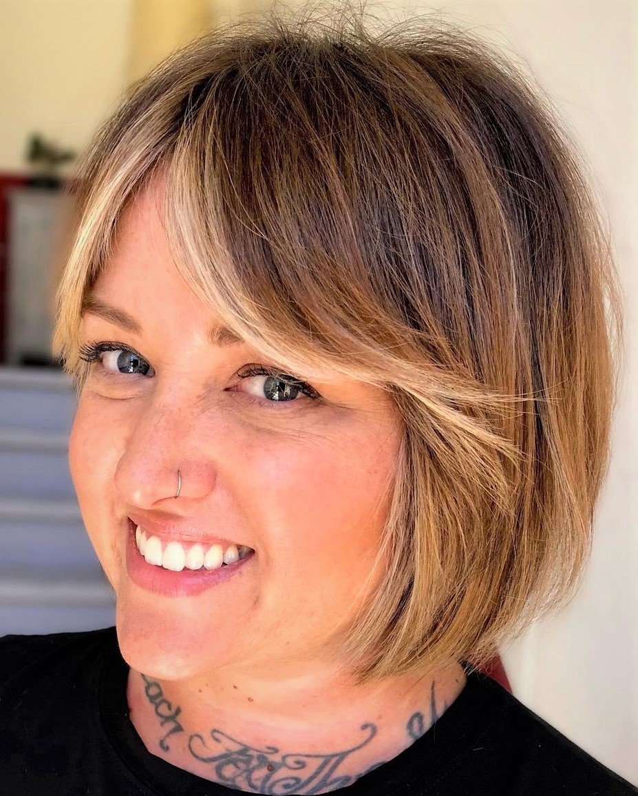 Glossy bob with curtain bangs short hair hairstyle