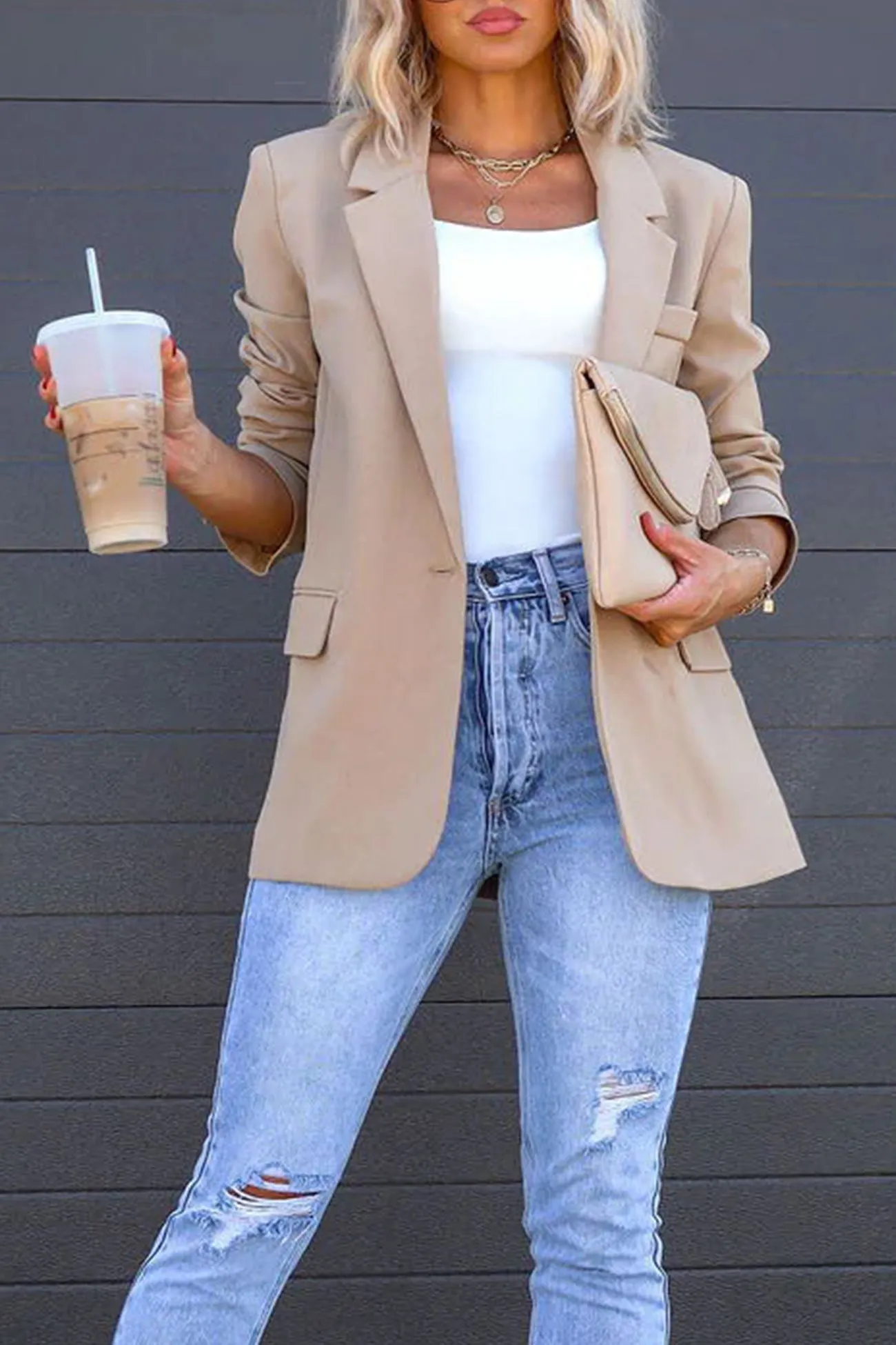 Beige blazer styled with light-wash wide-leg jeans