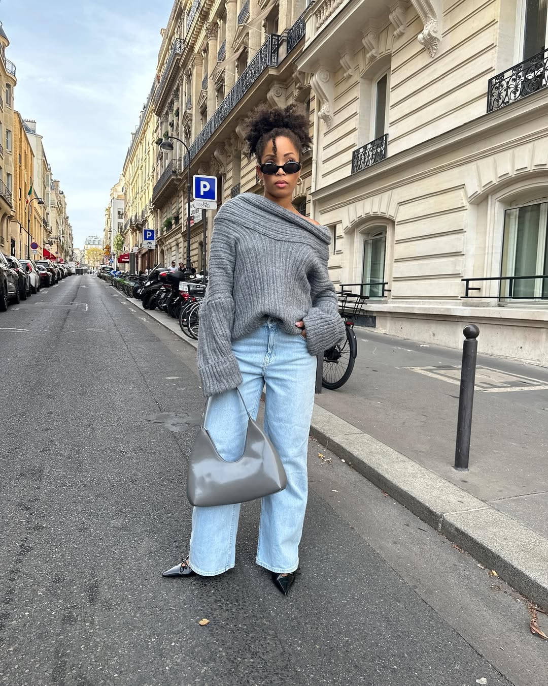 Off-the-shoulder knit top with dark jeans for a night out