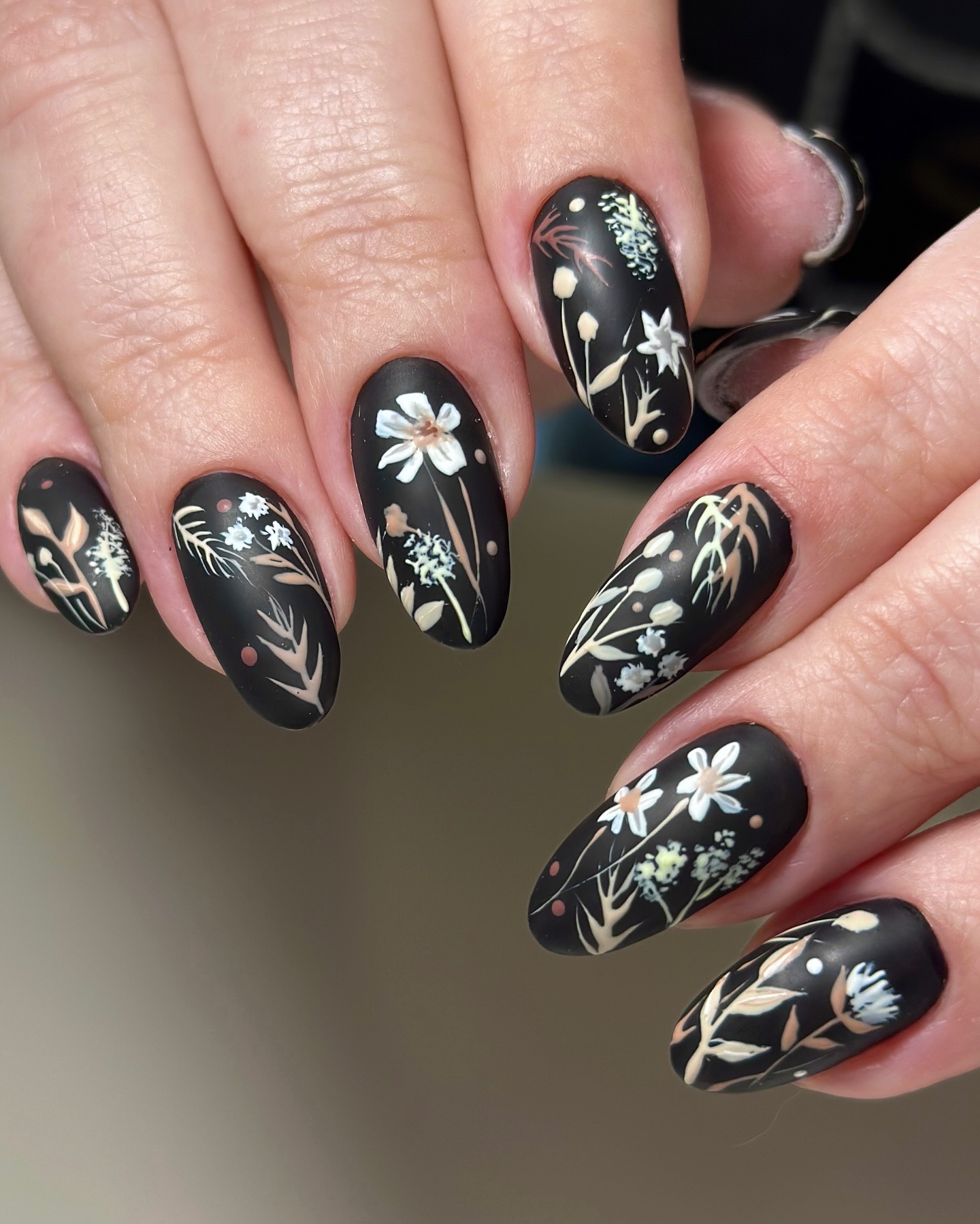 Black Nails with Delicate White Doodles photo