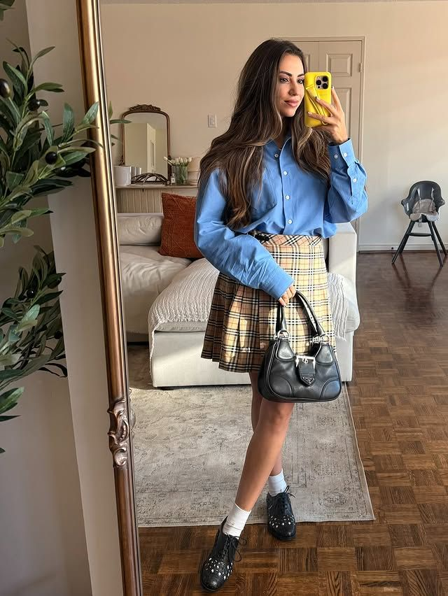 Crisp button-down shirt with a plaid mini skirt preppy outfit