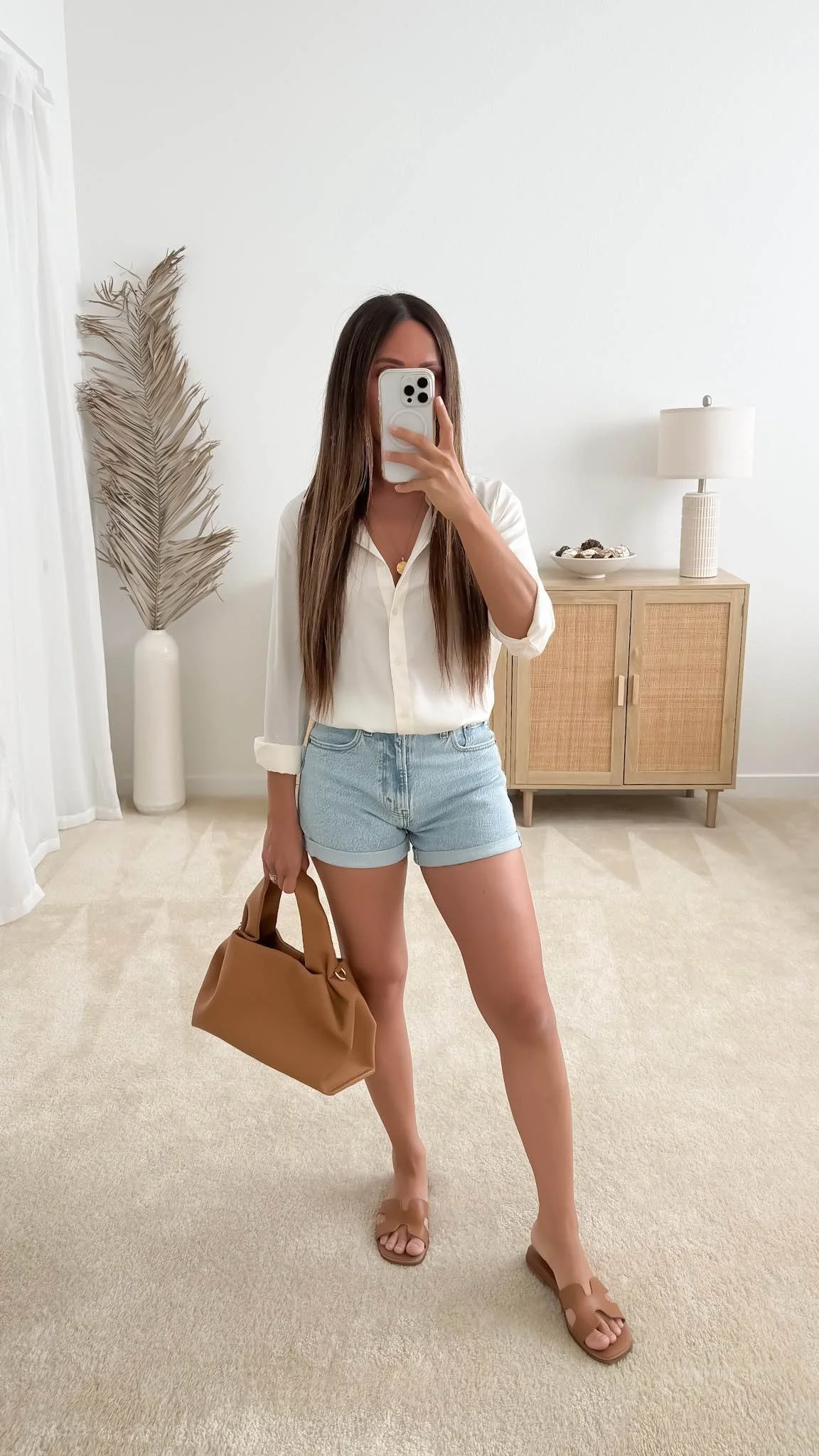 Denim shorts with a relaxed button-down shirt