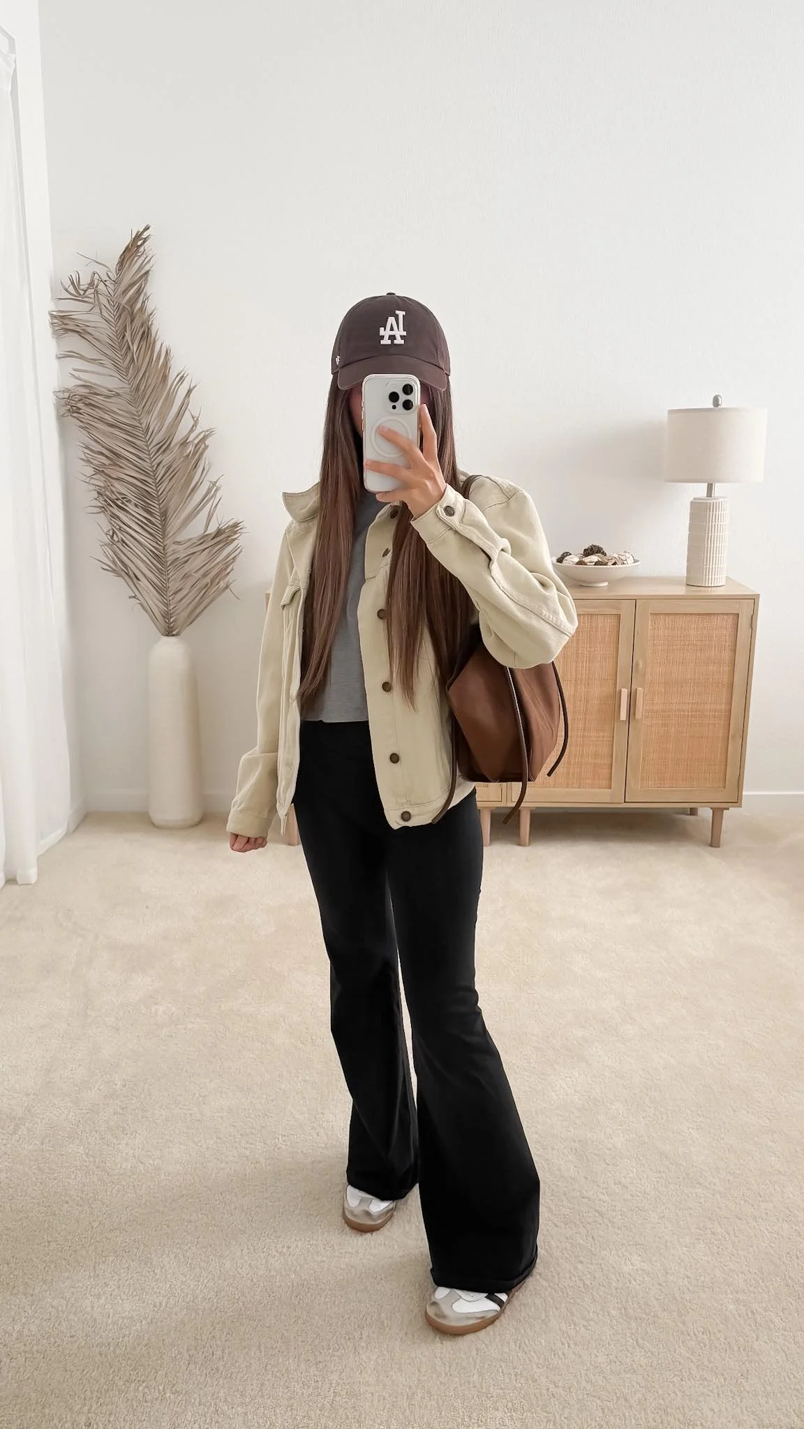 Flared leggings with a utility jacket and trainers