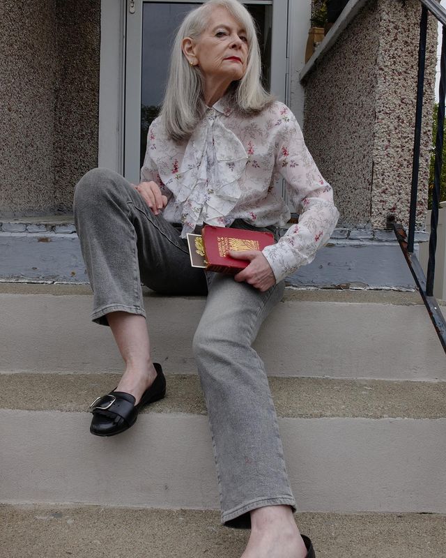 Grey wide-leg trousers with soft floral blouse job interview outfit