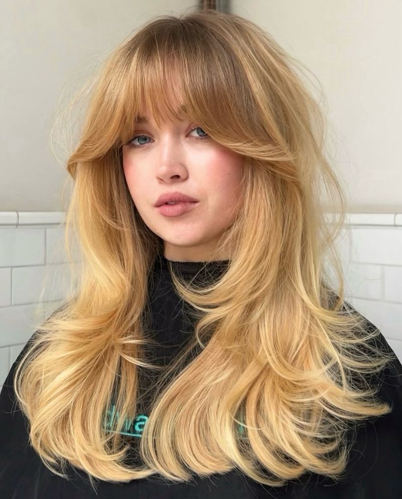 Bouncy Mid-Length Layers with a Chic Blowout layered hairstyle