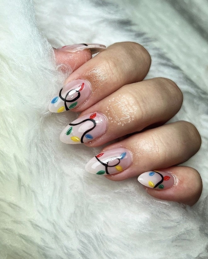 Dainty Christmas Light Strands on Almond Nails subtle Christmas nail design