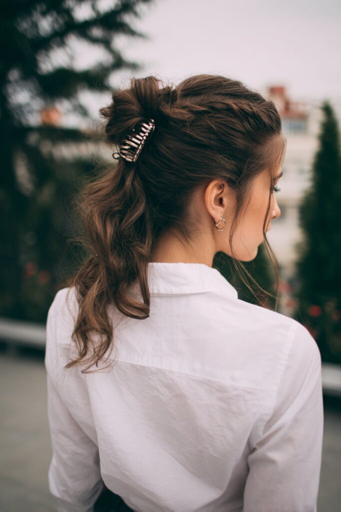 Half-up twist secured with a claw clip
