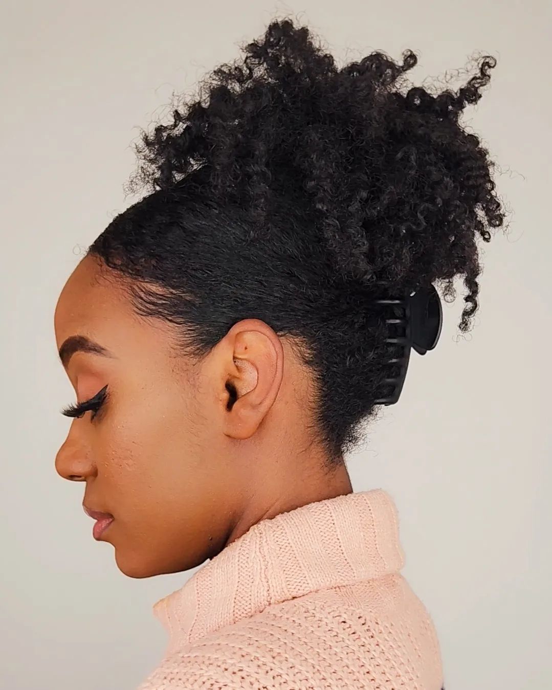 Oversized claw clip hairstyle for thick curly hair