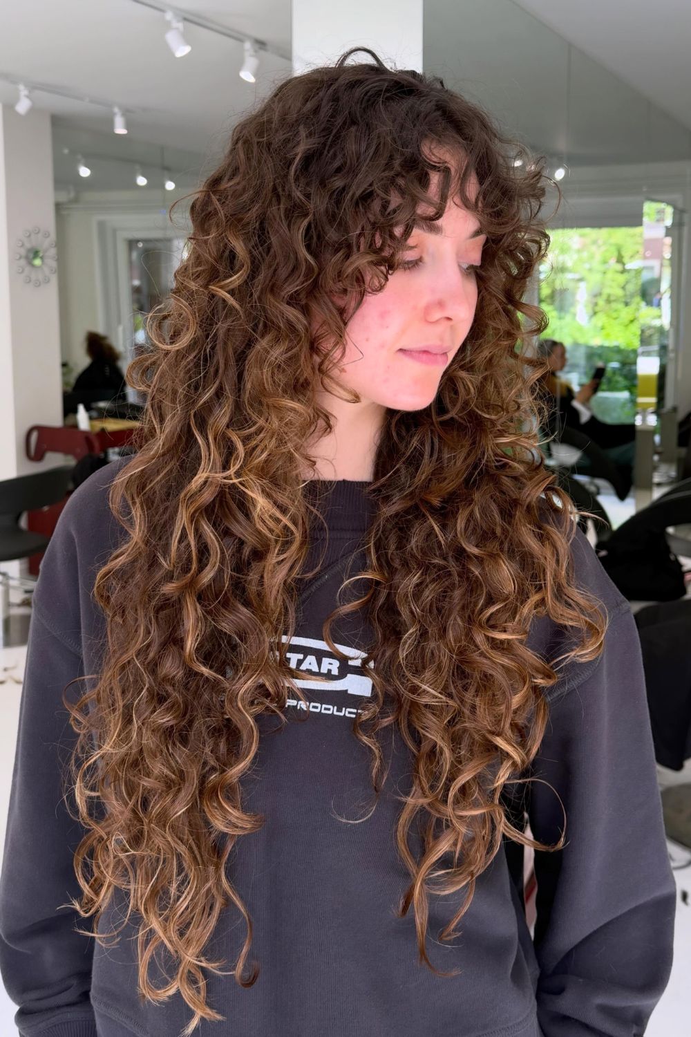 Long Curly Layers With a Soft Side Fringe hairstyle for round face