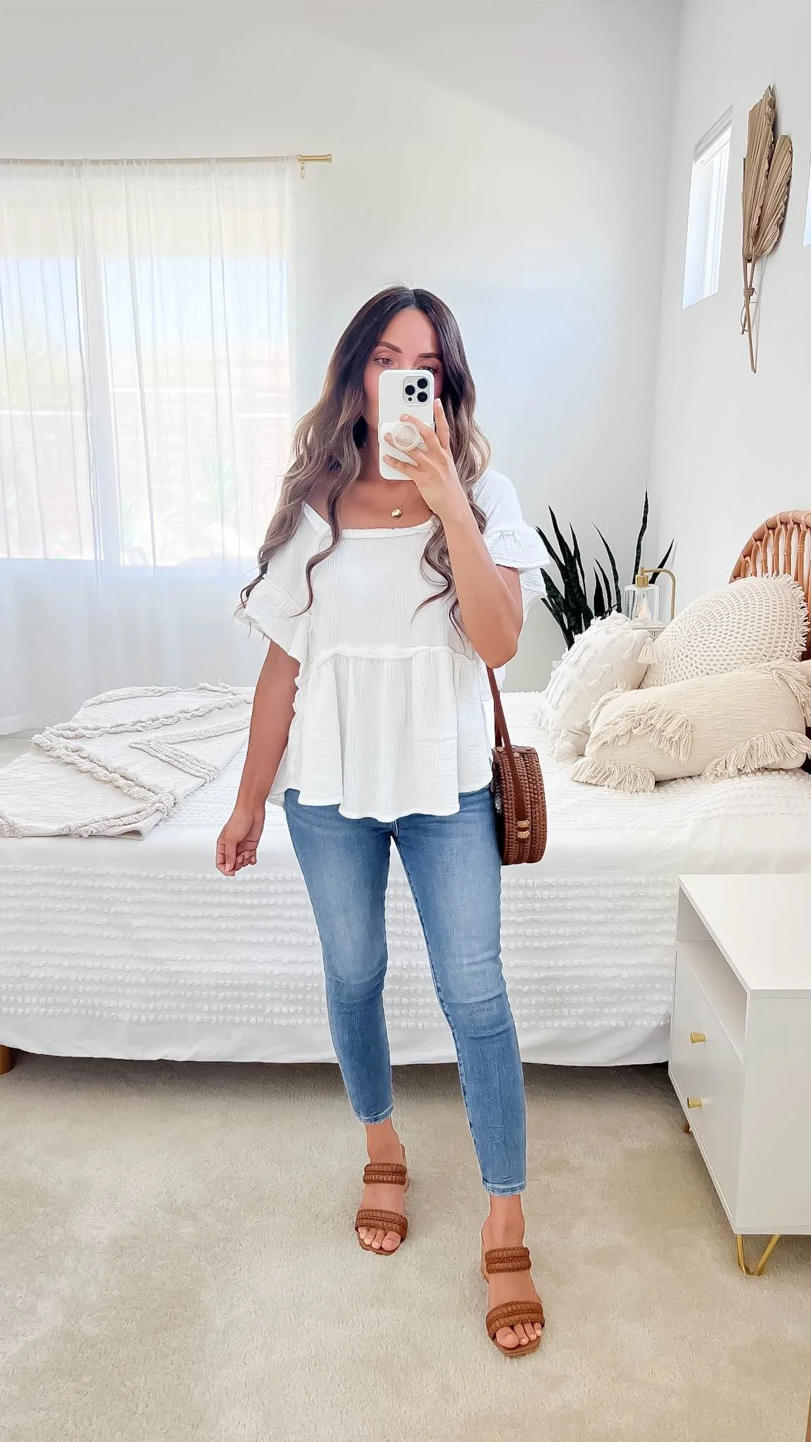 Babydoll top with slim jeans for a soft daytime photo