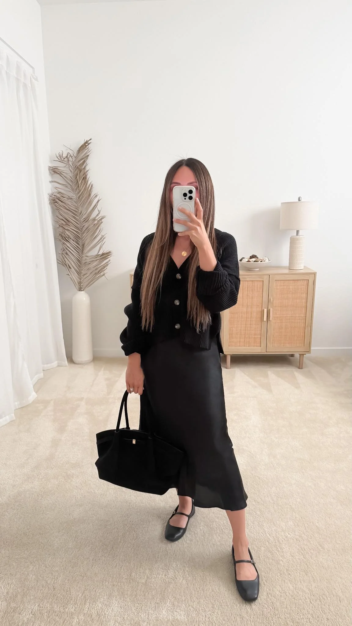 Black satin midi skirt with a fitted cardigan