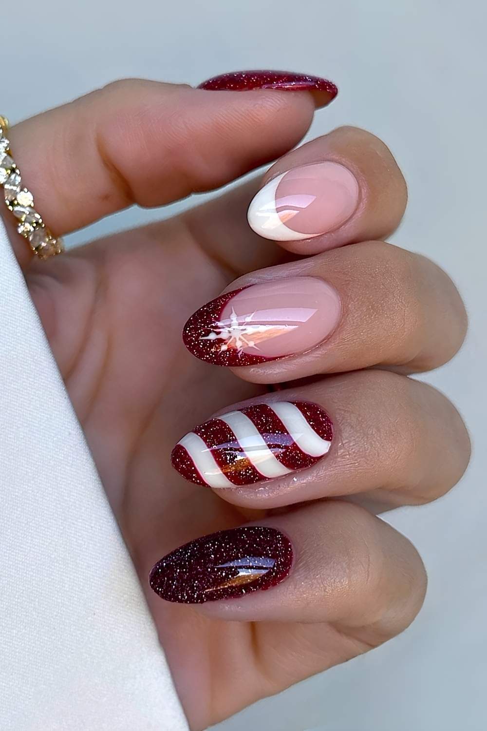 Dark Red Candy Cane Stripes with Snowflakes red and white nail design