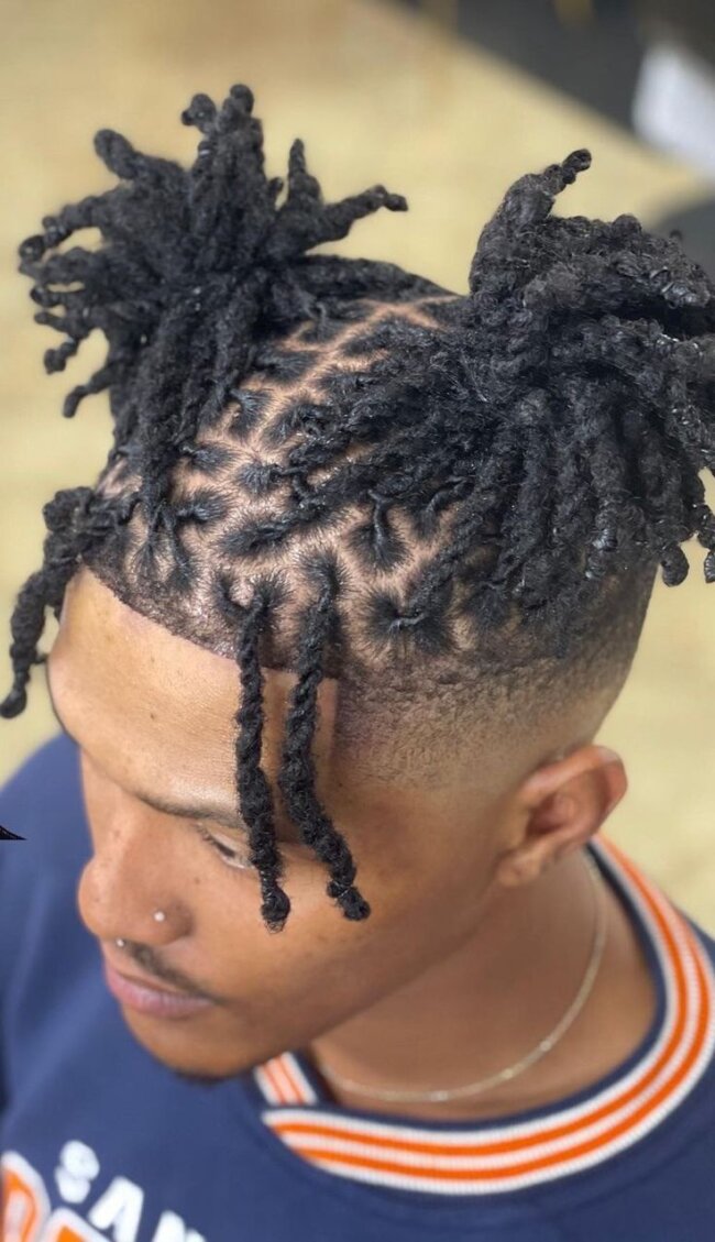 Double loc buns with playful symmetry