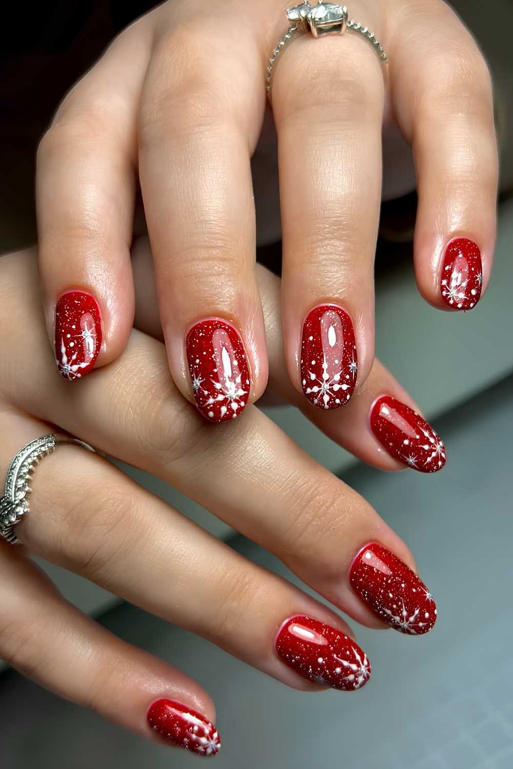 Red Glitter Nails with White Snowflake Art red and white nail design