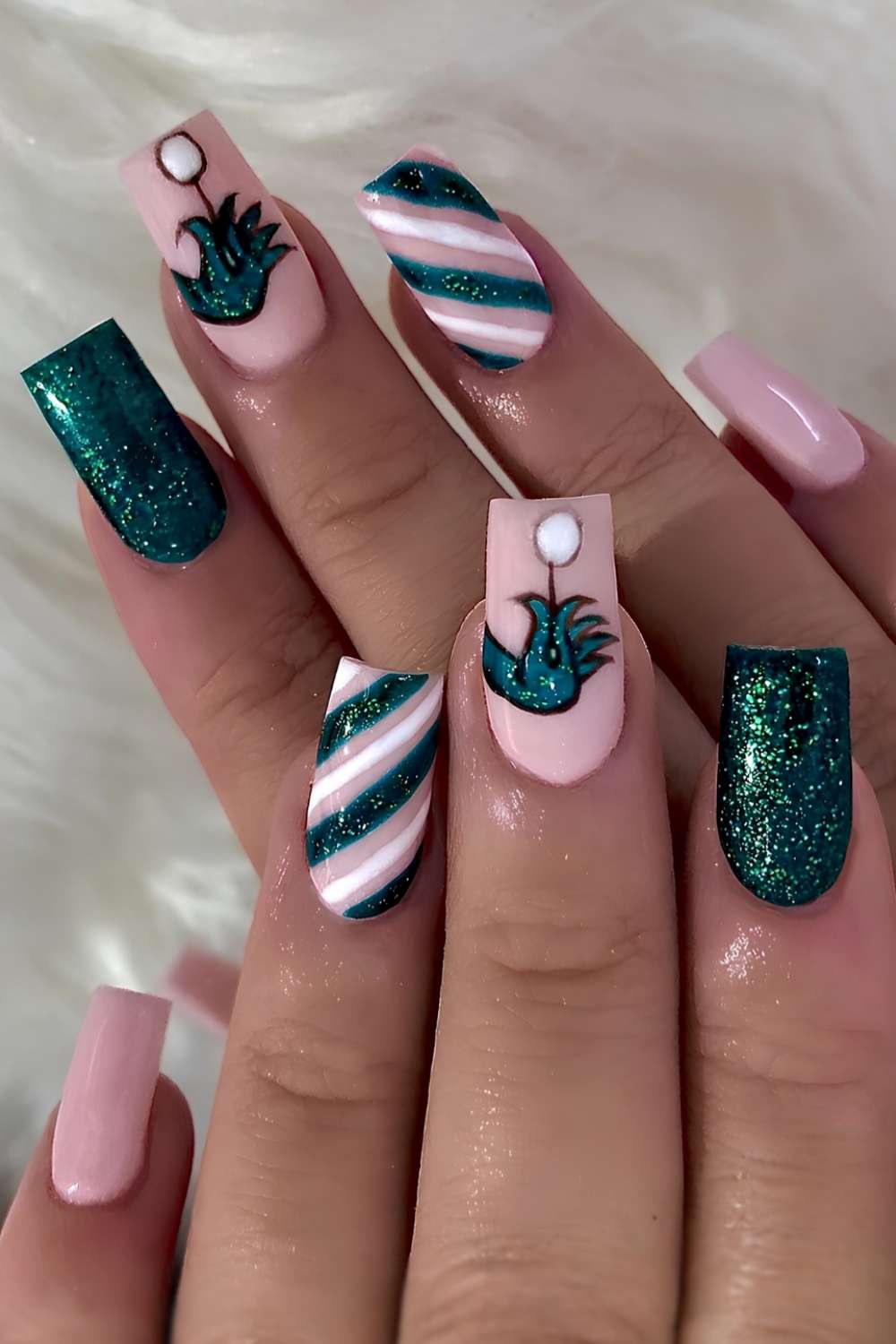 Playful Grinch-Inspired Green and Pink Nails green christmas nail design