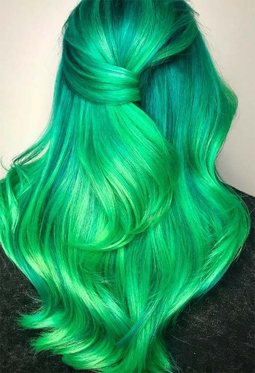 Bright teal hair pulled into a high ponytail