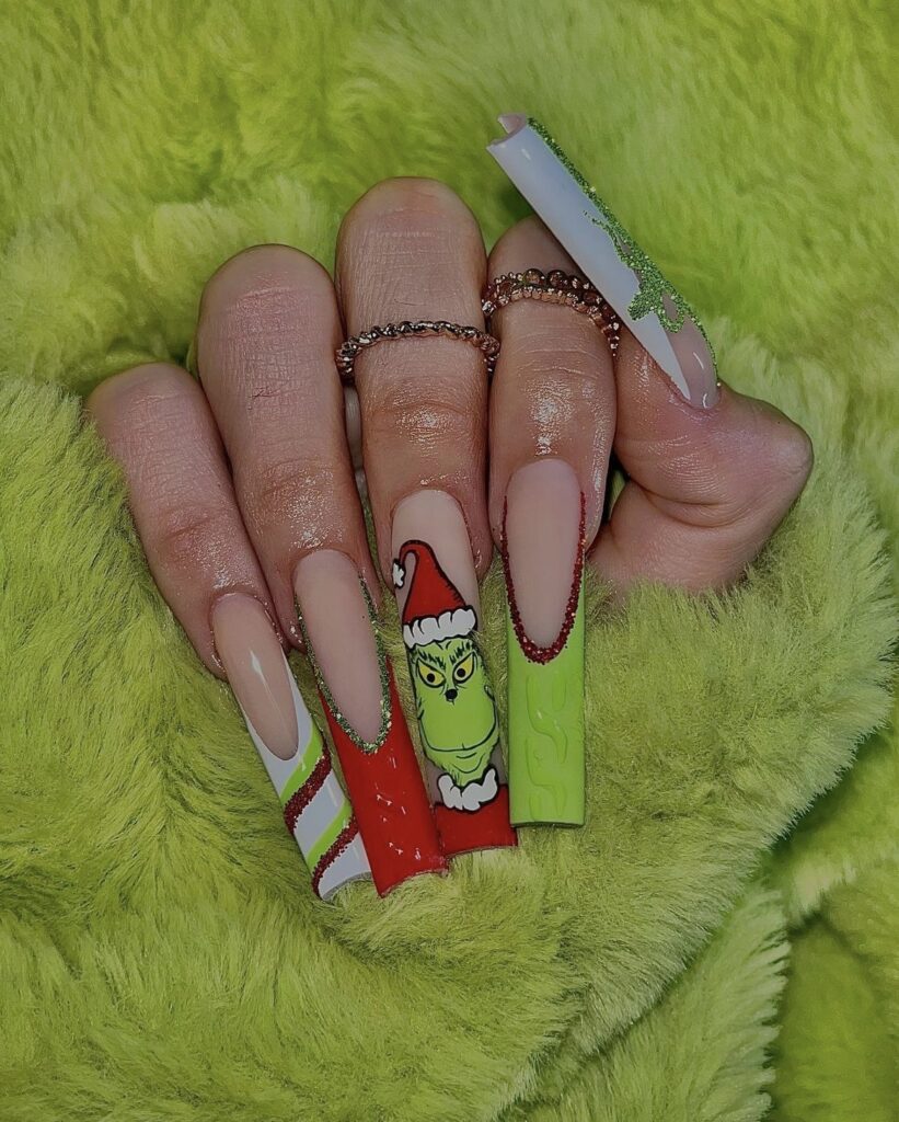 Grinch in a Santa Suit on Almond Nails grinch christmas nail design