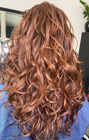 Copper brown spiral curls hairstyle