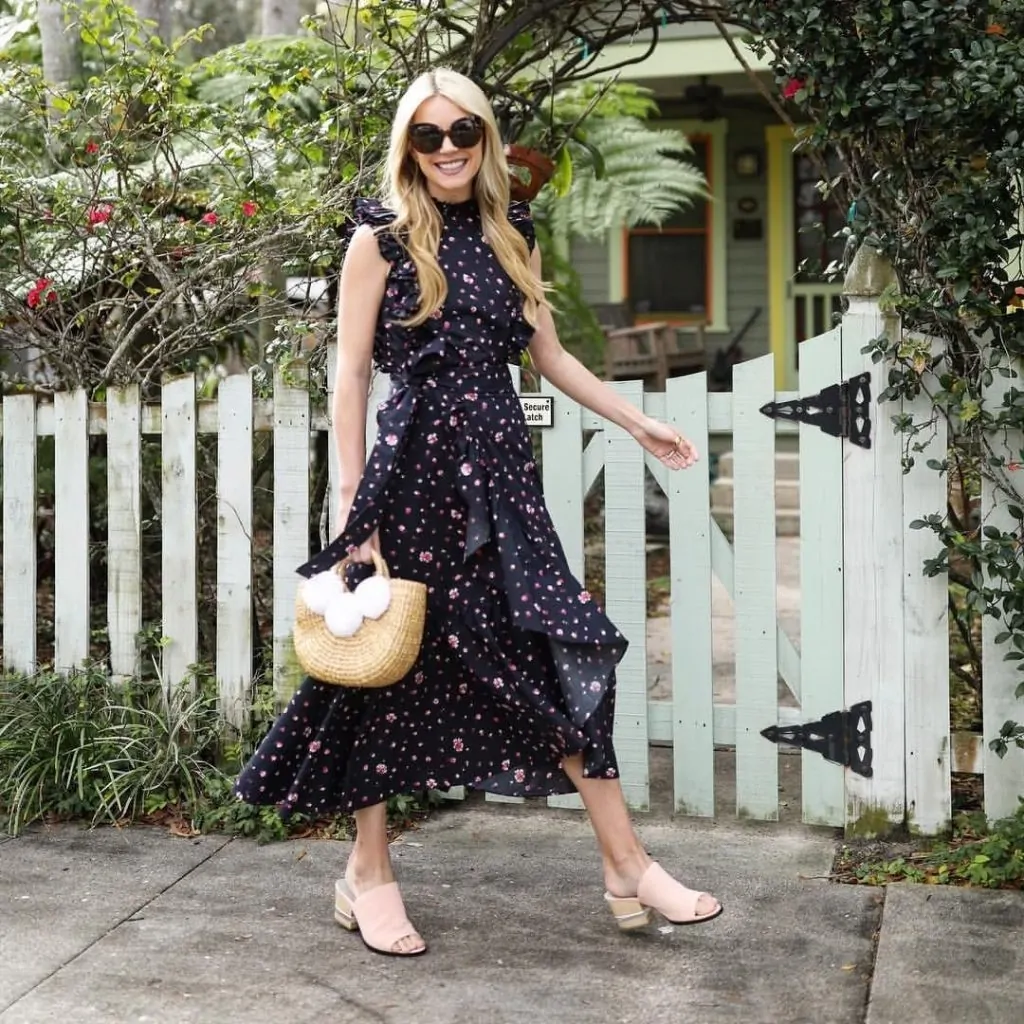 Soft pink mules with a black polka dot tiered dress