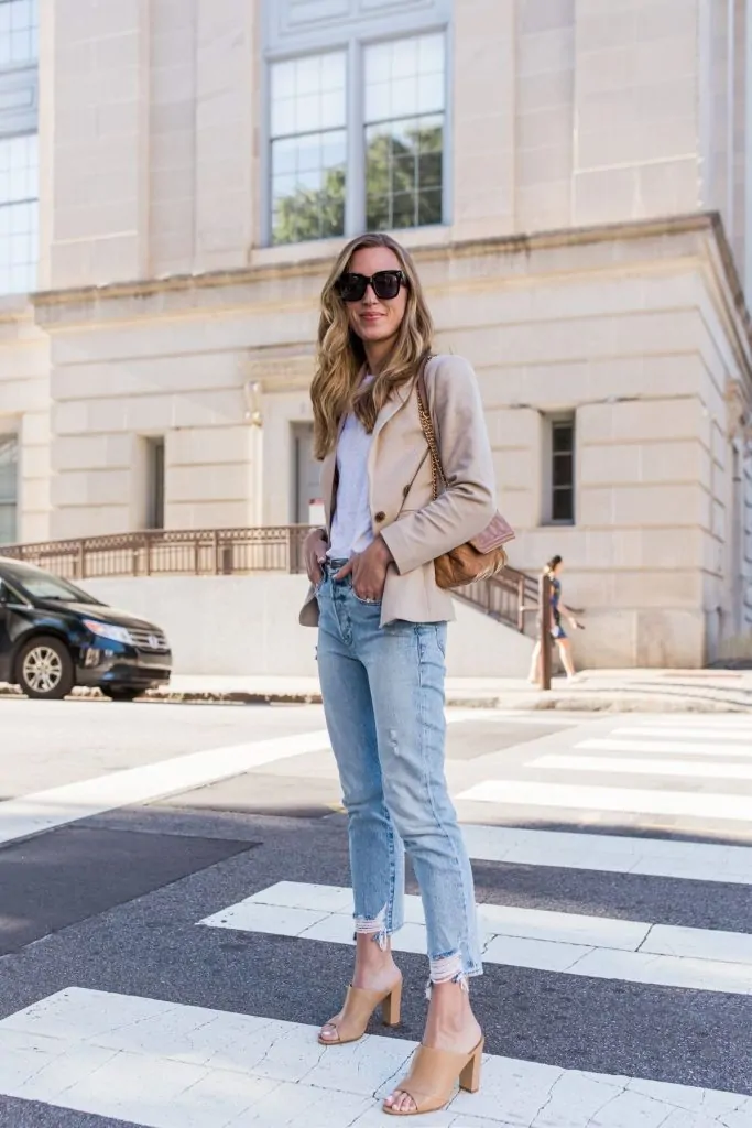 Tan block-heel mules with a beige blazer and straight jeans