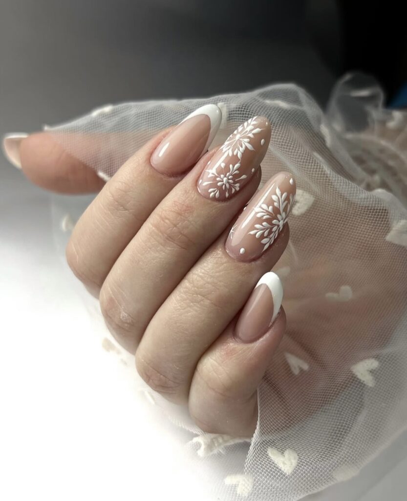 Almond Nude Nails with Delicate White Snowflakes neutral Christmas nail design