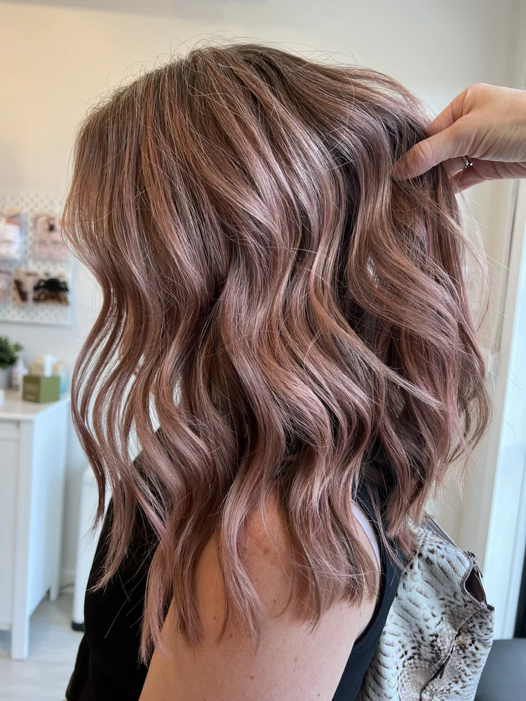 Rose-gold glints on warm brunette hair