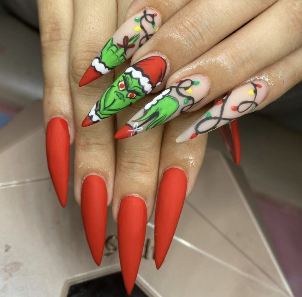 Pointed Grinch Nails with a Santa Hat grinch christmas nail design
